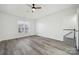 Bright bedroom with wood-look floors and a ceiling fan at 6518 Afterglow Dr, Indian Trail, NC 28079