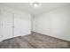 Bedroom with double door closet and wood-look floors at 6518 Afterglow Dr, Indian Trail, NC 28079