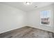 Bright bedroom with wood-look floors and a window at 6518 Afterglow Dr, Indian Trail, NC 28079