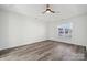 Bright bedroom with hardwood floors and a large window at 6518 Afterglow Dr, Indian Trail, NC 28079