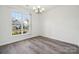 Bright dining room with large window and laminate flooring at 6518 Afterglow Dr, Indian Trail, NC 28079