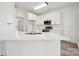 Modern kitchen with white cabinets and large island at 6518 Afterglow Dr, Indian Trail, NC 28079