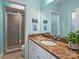 Bathroom with granite countertop, white cabinets, and shower at 6819 Conservatory Ln, Charlotte, NC 28210