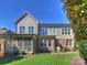 Back exterior of a two-story home, featuring a screened porch, brick accents, and a well-maintained yard at 6819 Conservatory Ln, Charlotte, NC 28210