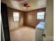 Bedroom featuring paneled walls, ceiling fan, and a washer/dryer at 6862 Royal Heights Cir, Hickory, NC 28602