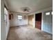 Bedroom featuring paneled walls, ceiling fan, and closet space at 6862 Royal Heights Cir, Hickory, NC 28602