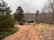 Dirt driveway leading to a carport and home at 6862 Royal Heights Cir, Hickory, NC 28602