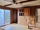 Living area with paneled walls and sliding glass doors to the outside at 6862 Royal Heights Cir, Hickory, NC 28602