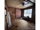 Living room with brick fireplace and wood paneling at 6862 Royal Heights Cir, Hickory, NC 28602