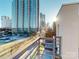 Balcony with city views and modern railing at 701 N Church St # 9, Charlotte, NC 28202