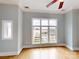 Bright bedroom with hardwood floors and large windows at 701 N Church St # 9, Charlotte, NC 28202