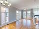 Spacious living area with hardwood floors and large windows at 701 N Church St # 9, Charlotte, NC 28202