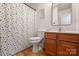 Updated bathroom with a shower and a colorful shower curtain at 748 Inwood Hill Dr, Gastonia, NC 28056