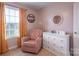 bedroom with a dresser, chair, and natural light at 748 Inwood Hill Dr, Gastonia, NC 28056