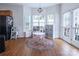 Bright breakfast nook features a round table, built in shelving, and hardwood floors at 748 Inwood Hill Dr, Gastonia, NC 28056