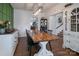 Dining room with rustic table and view into kitchen at 748 Inwood Hill Dr, Gastonia, NC 28056