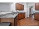 Kitchen with granite counters and wooden cabinets at 748 Inwood Hill Dr, Gastonia, NC 28056