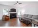 Living room with gray sectional sofa and fireplace at 748 Inwood Hill Dr, Gastonia, NC 28056