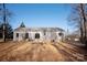 House back view with patio and wooded backyard at 7504 Surry Ln, Indian Trail, NC 28079