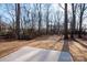 Spacious backyard with a patio and mature trees at 7504 Surry Ln, Indian Trail, NC 28079