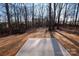 Large backyard with a patio and mature trees at 7504 Surry Ln, Indian Trail, NC 28079