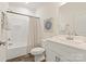 Clean bathroom featuring a tub shower, toilet and vanity with white cabinets at 7504 Surry Ln, Indian Trail, NC 28079