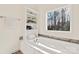 Bathroom with soaking tub, built-in shelving, and large window at 7504 Surry Ln, Indian Trail, NC 28079