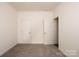 Empty bedroom with two doors and grey carpet at 7504 Surry Ln, Indian Trail, NC 28079