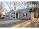 Gray house with a front yard and concrete pathway at 7504 Surry Ln, Indian Trail, NC 28079