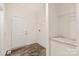 Laundry room with built in shelving, a door and vinyl flooring at 7504 Surry Ln, Indian Trail, NC 28079