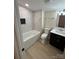 Updated bathroom with a marble tiled shower and modern vanity at 757 Bilmark Ave, Charlotte, NC 28213