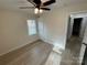 Spacious bedroom with ceiling fan and hardwood floors at 757 Bilmark Ave, Charlotte, NC 28213