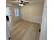 Well-lit bedroom with hardwood floors and ceiling fan at 757 Bilmark Ave, Charlotte, NC 28213