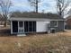 Rear view of house with screened porch at 757 Bilmark Ave, Charlotte, NC 28213