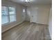 Spacious living area with hardwood floors and access to the front entrance at 757 Bilmark Ave, Charlotte, NC 28213