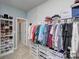 Well-organized closet with shoe storage and hanging rods at 8119 Merryvale Ln, Charlotte, NC 28214