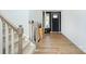 Bright entryway with hardwood floors and staircase at 8119 Merryvale Ln, Charlotte, NC 28214