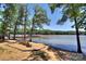 Seating area by the lake with a view of boats on the water at 8119 Merryvale Ln, Charlotte, NC 28214