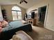 Main bedroom with vaulted ceiling, arched window and ensuite bath at 959 Avery Ct, Concord, NC 28025