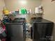 Laundry room with washer, dryer, and convenient shelving at 959 Avery Ct, Concord, NC 28025