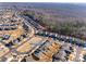 Aerial view of homes with modern architecture and landscaping with solar panels in a well-planned residential community at 975 Shorthill Ln, Fort Mill, SC 29715