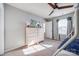 ' bedroom with a light wood dresser, ceiling fan, and natural light from the window at 975 Shorthill Ln, Fort Mill, SC 29715