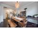 Charming dining area features a rustic table with bench, hutch, and access to the staircase at 975 Shorthill Ln, Fort Mill, SC 29715