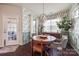 Dining area features a round wooden table, patterned wallpaper, and ample natural light at 975 Shorthill Ln, Fort Mill, SC 29715