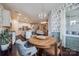 Open concept dining area with a wooden table, decorative lighting, and adjacent kitchen at 975 Shorthill Ln, Fort Mill, SC 29715