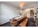 Dining room with decorative molding, rustic dining table, bench, and a view to the staircase at 975 Shorthill Ln, Fort Mill, SC 29715