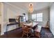 Dining room with farmhouse-style table, bench seating, hutch, and abundant natural light at 975 Shorthill Ln, Fort Mill, SC 29715