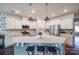 Modern kitchen features white cabinets, quartz counters, and stainless steel appliances at 975 Shorthill Ln, Fort Mill, SC 29715