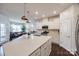 Spacious kitchen with stainless steel appliances, quartz counters and a connected dining area at 975 Shorthill Ln, Fort Mill, SC 29715