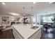 Modern kitchen with large island and view to living room at 975 Shorthill Ln, Fort Mill, SC 29715